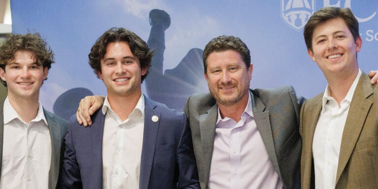 Four guys posing together.