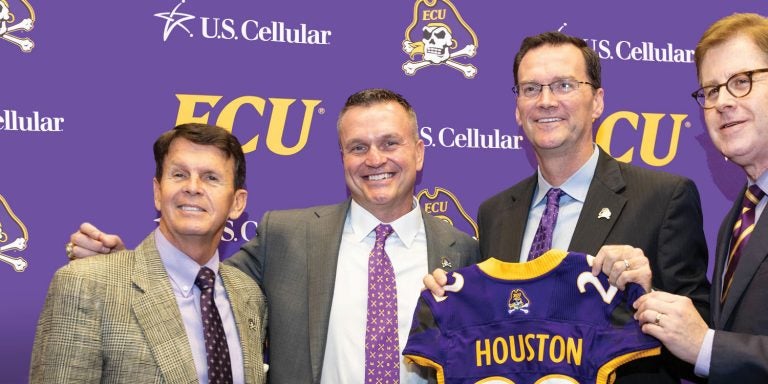 From left, Dave Hart, special advisor to the chancellor for athletics, football coach Mike Houston, athletic director Jon Gilbert, and Chancellor Cecil Staton are shown during Houston’s introductory news conference Dec. 4 in the Murphy Center. Photo by Cliff Hollis.
