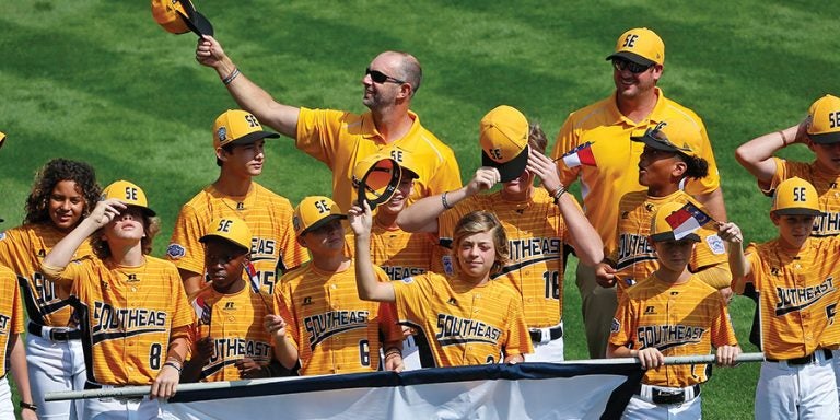 Brian Fields ’98 ’01 (holding out hat) led a team of 12-year-olds to the national spotlight.