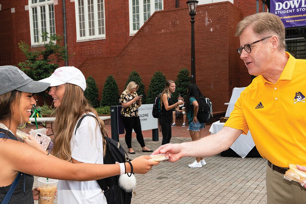 On the first morning of classes Aug. 20, Chancellor Cecil Staton handed out coffee and cookies to students.