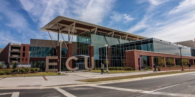 The LEED-certified center is 220,000 square feet built on about seven acres. The total project cost was $122 million. T.A. Loving and Barnhill Contracting Co. built the center, its chiller plant and the 724-space parking deck. Out front, lofty “ECU” letters make a bold statement, welcoming Pirates and visitors to the new front porch and living room of the university.