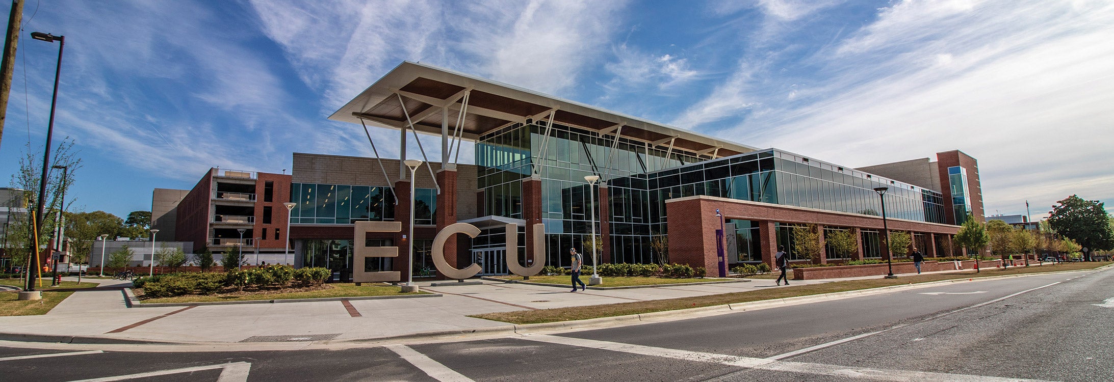 The LEED-certified center is 220,000 square feet built on about seven acres. The total project cost was $122 million. T.A. Loving and Barnhill Contracting Co. built the center, its chiller plant and the 724-space parking deck. Out front, lofty “ECU” letters make a bold statement, welcoming Pirates and visitors to the new front porch and living room of the university.