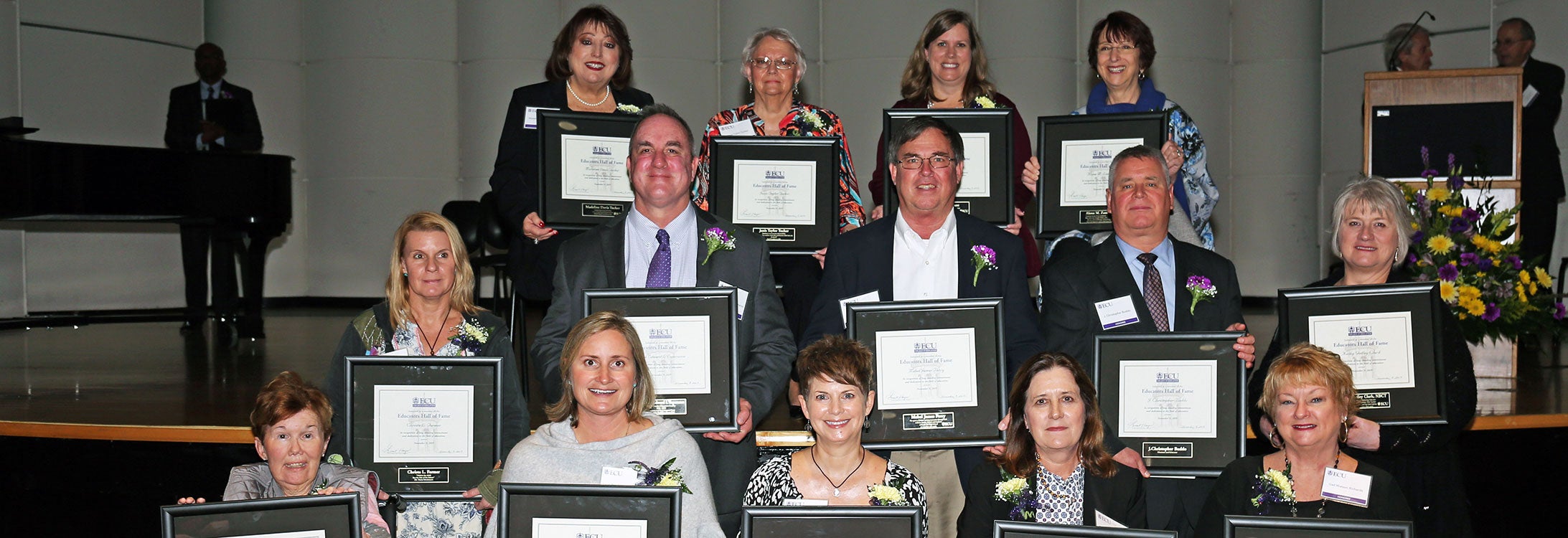 Members of the 2019 class of inductees to the ECU College of Education Educators Hall of Fame include, back row, from left, Madeline Davis Tucker, Janis Taylor Tucker, Lynne C. Wigent, and Alana M. Zambone; middle row, from left, Christa L. Farmer, Mark Edward L’Esperance, a representative for the late Mabel James Perry, J. Christopher Buddo, and Kathy Godley Clark; and front row, from left, Kathy Sue Gaskins Riggs, Lynn Pritchett Harrington, Sherry Rae Buck, Andrea Mills Blackwood, and Gail Watson Richards. (Photo by Kristen Martin)