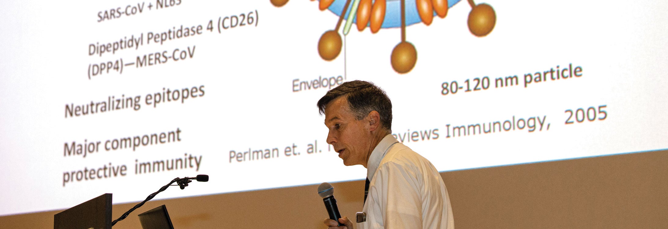 Dr. Paul Cook, chief of the Division of Infectious Diseases at the Brody School of Medicine, speaks to a group about the coronavirus.