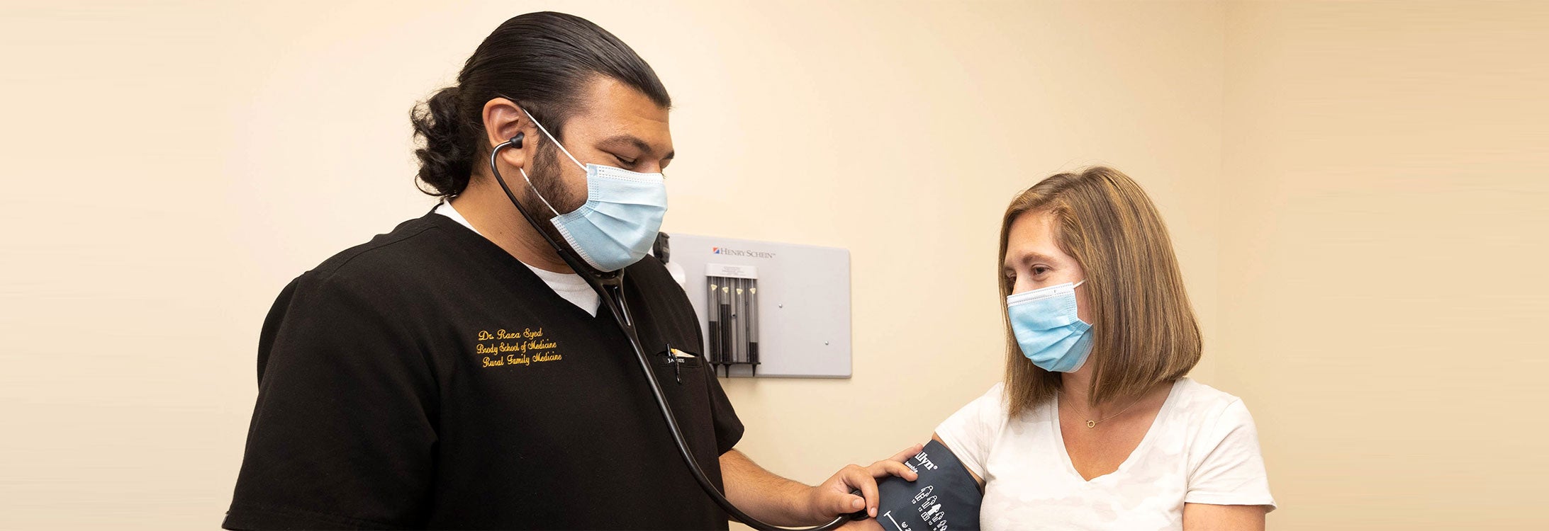Dr. Raza Syed, one of the first residents in ECU and Vidant Health’s new rural family medicine residency program, examines a patient at Roanoke Chowan Community Health Center in Ahoskie.