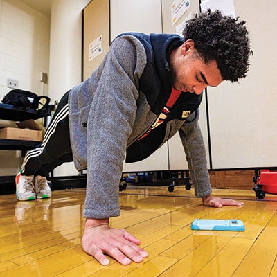 A student does pushups