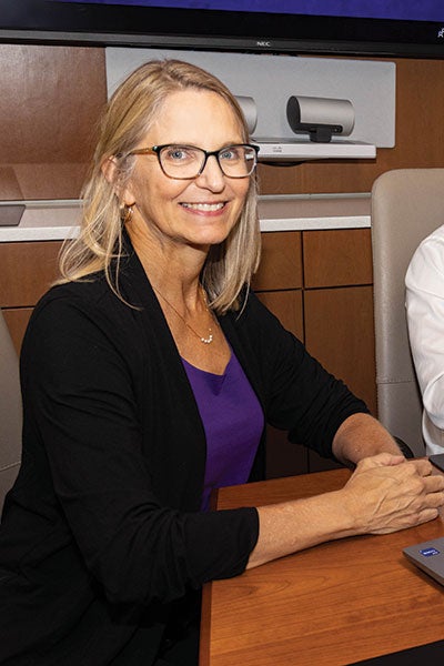 A woman in a sports jacket.