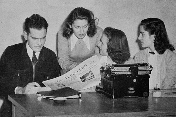 an old photo of three women and a man