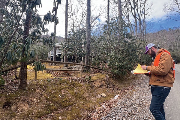 Construction worker in the woods.